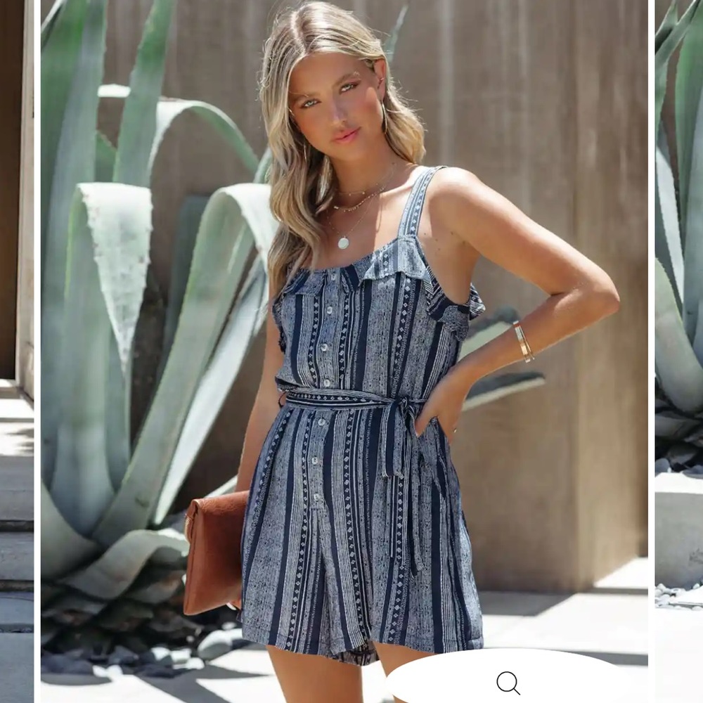 Blue romper from Vici. Brand new with tags.